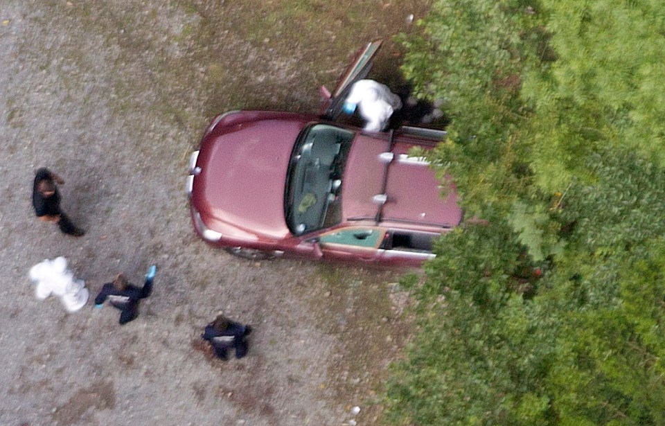 The family was found in their BMW by another cyclist
