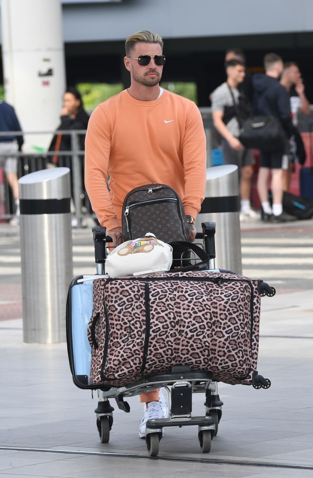 Car salesman Carl took charge of wheeling Katie's bags