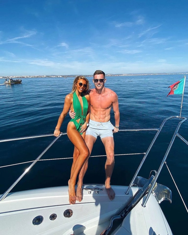 Dean Henderson and his wife relax on a boat on holiday