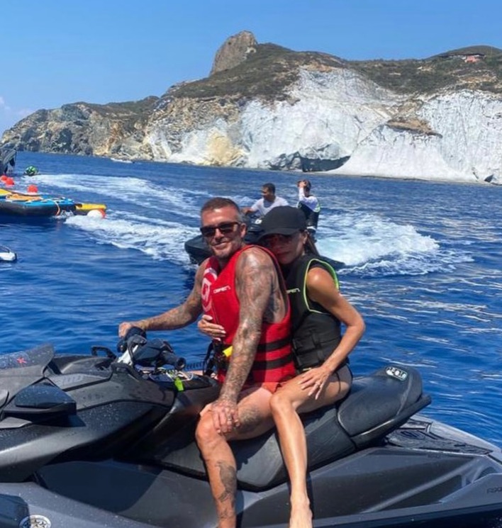 Victoria was seen cuddling up to beau David on the back of a jet ski