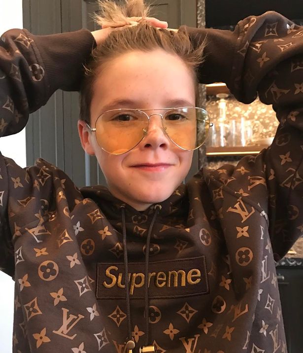 Like mum Victoria, Harper is the fashionista of the family - modelling a Lous Vuitton x Supreme hoodie