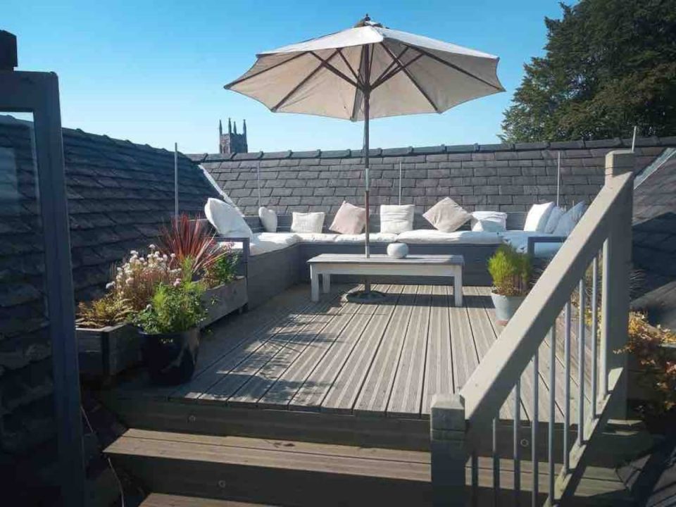 The AirBnB has a large terrace that looks like the Love Island firepit