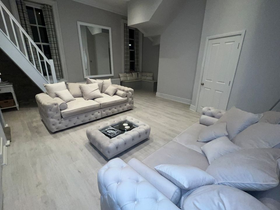 Chloe's place has a huge living room and kitchen