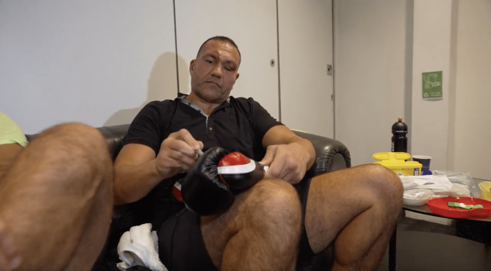 Kubrat Pulev signing a glove for Derek Chisora