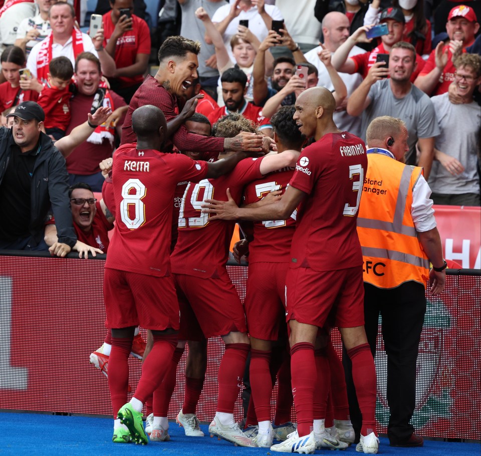 Liverpool celebrate their third goal of the game