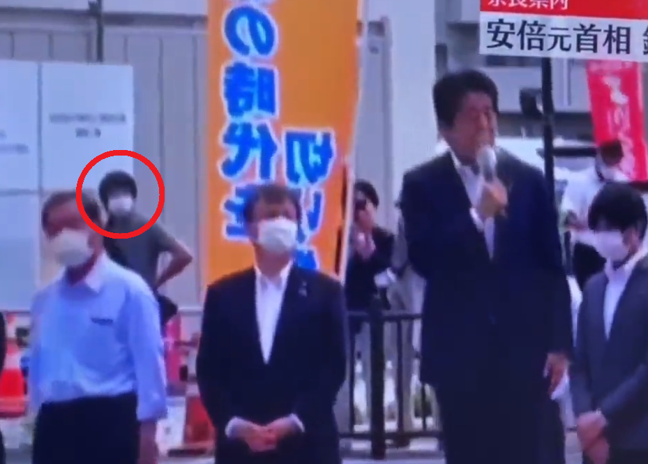 Chilling footage shows him lurking in the crowd in the moments before the attack