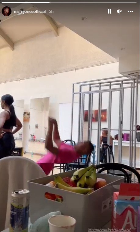 Neil filmed as fellow dancer Cameron struck a move