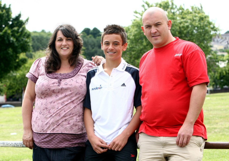 Diver Tom Daley poses for a picture with his parents Rob and Debbie during the Press Day at Central Park Pools back in 2008