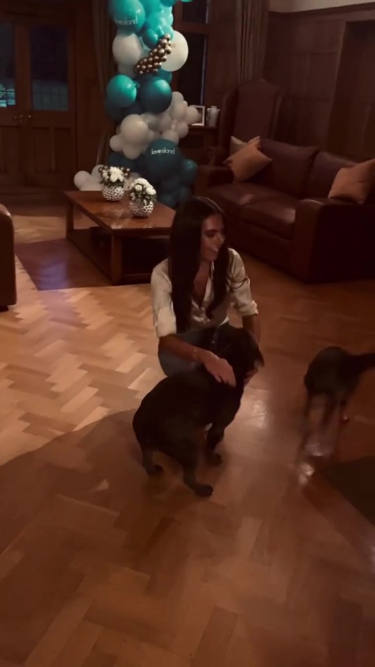 The Love Island star was greeted by her adorable dogs