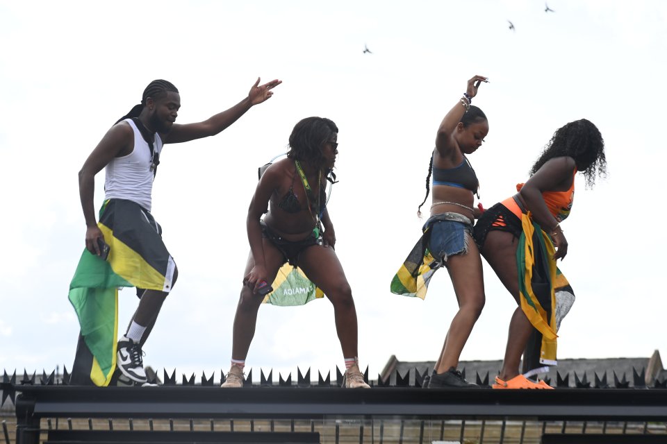 Revellers take to a roof to dance