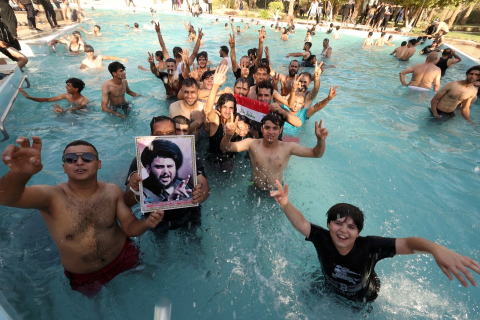 Supporters of Iraqi populist leader Moqtada al-Sadr swim in the presidential pool