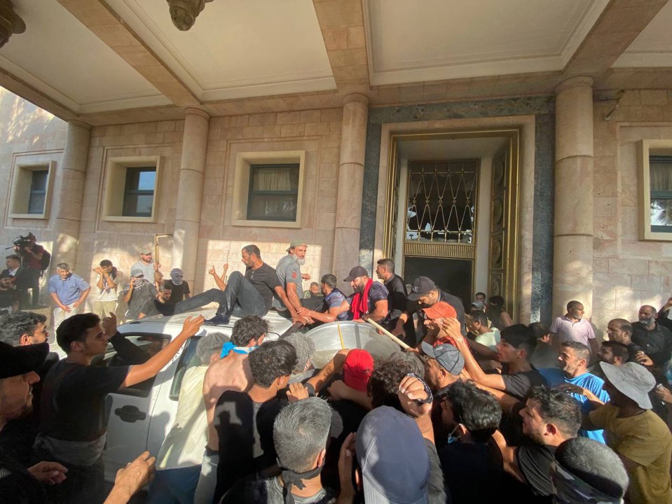 Protesters lounged in armchairs in meeting rooms, while others waved Iraqi flags