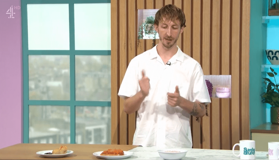 Man demonstrating food preparation on a cooking show.