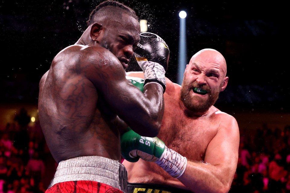 Deontay Wilder and Tyson Fury in their 2021 trilogy fight