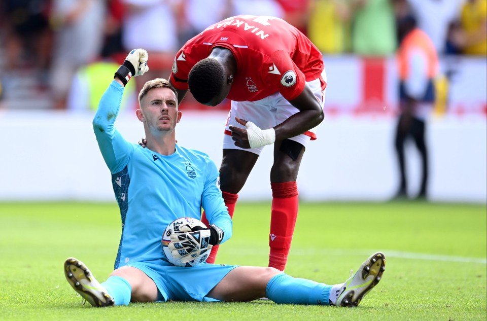 Dean Henderson celebrates saving Declan Rice's penalty