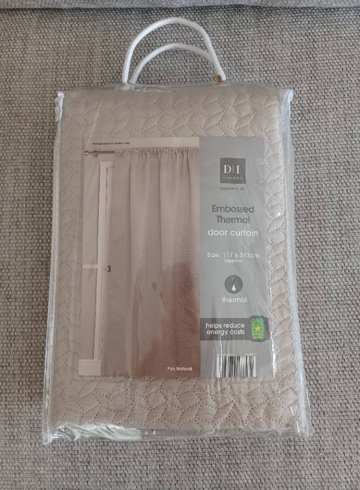 The curtain didn't have a price on it, but she was thrilled to find out the cost