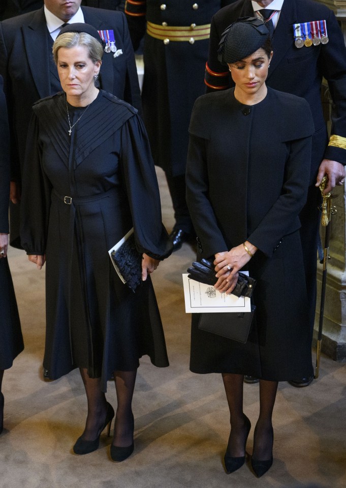The Queen Consort, Kate, Sophie and Meghan side by side in Westminster Hall
