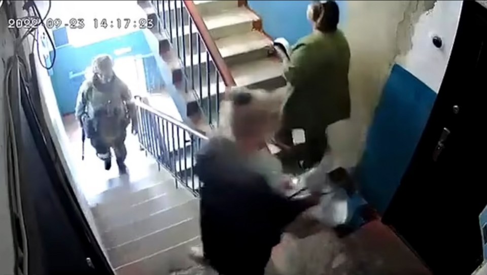 Armed soldiers go door-to-door to collect votes in the referendum in Zaporizhzhia