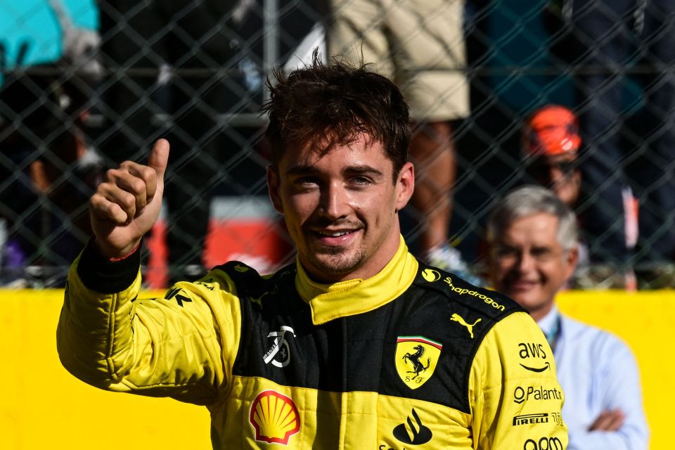 Charles Leclerc gives a thumbs up after taking pole for the Italian GP