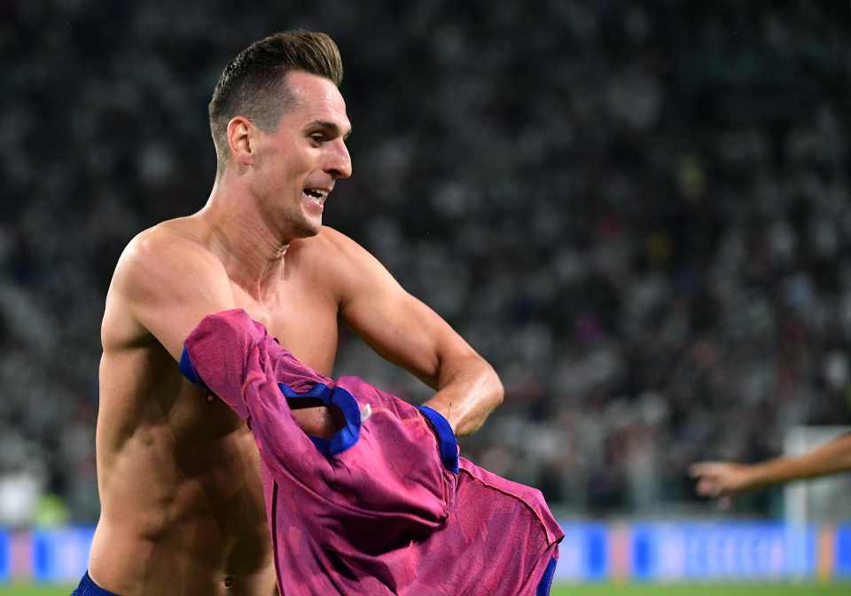 The Pole removes his shirt in celebration