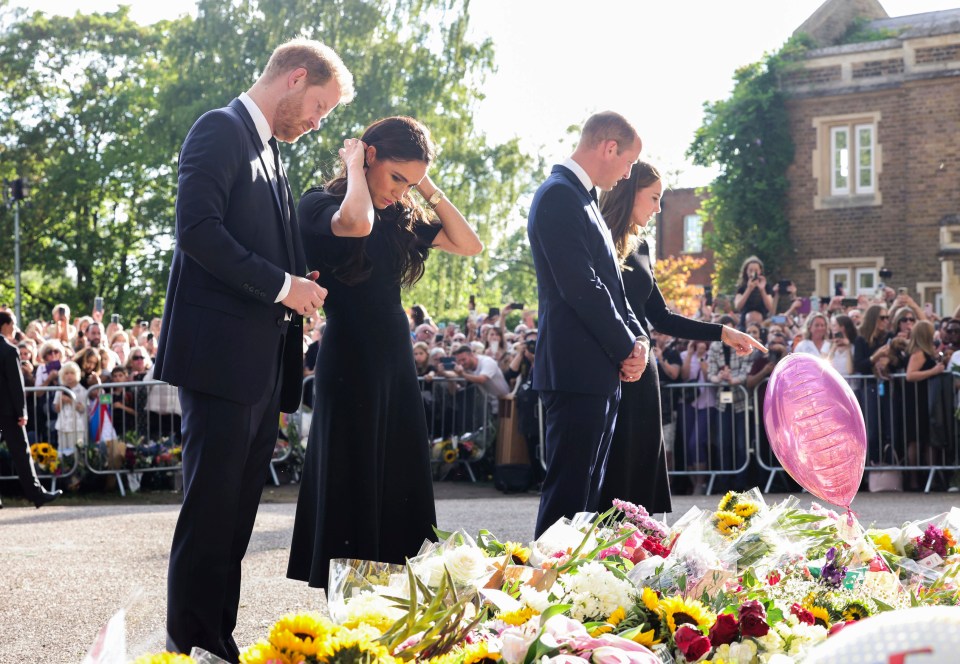 The once-named 'Fab Four' viewed floral tributes to the Queen
