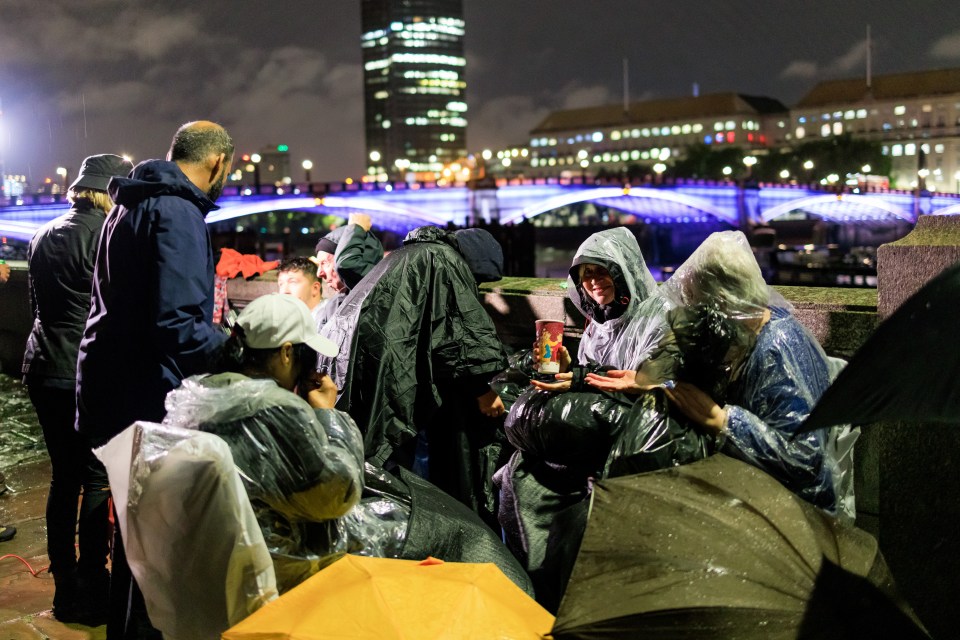 Mourners spent the night under the pouring rain to say goodbye to the Queen