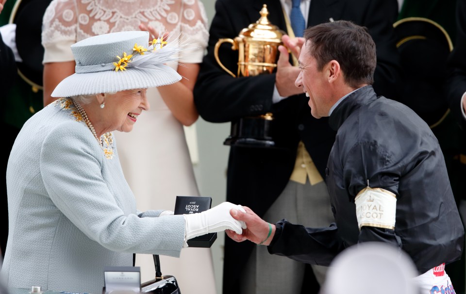 Frankie Dettori collecting his prize from The Majesty after winning the Gold Cup on Stradivarius