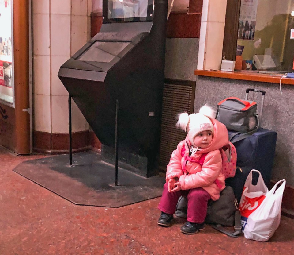 A little girl is seen fleeing the Ukrainian city of Lviv following Russia’s invasion of Ukraine in February