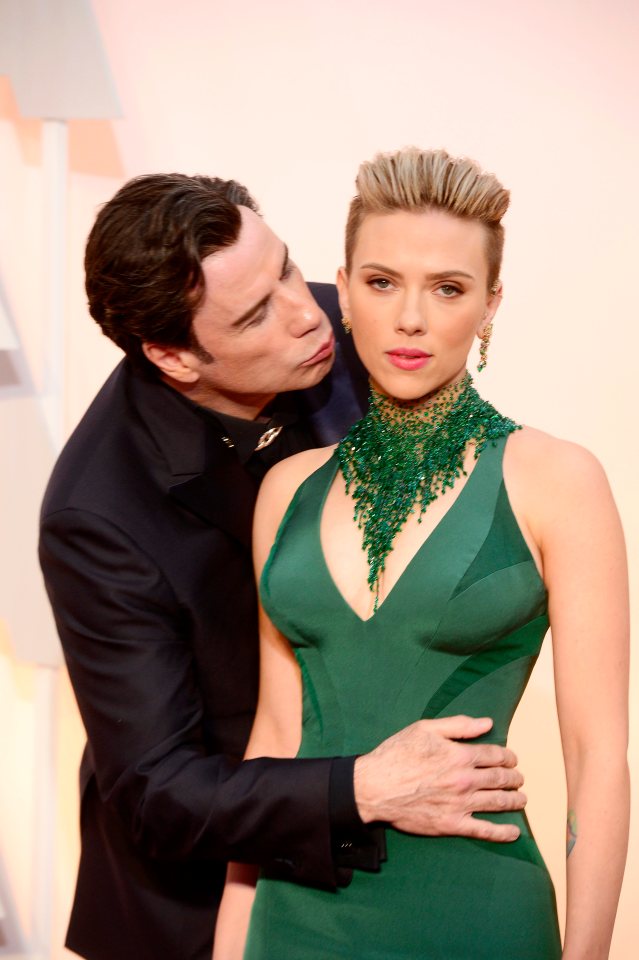 Scarlett Johansson was forced to defend John Travolta's kiss