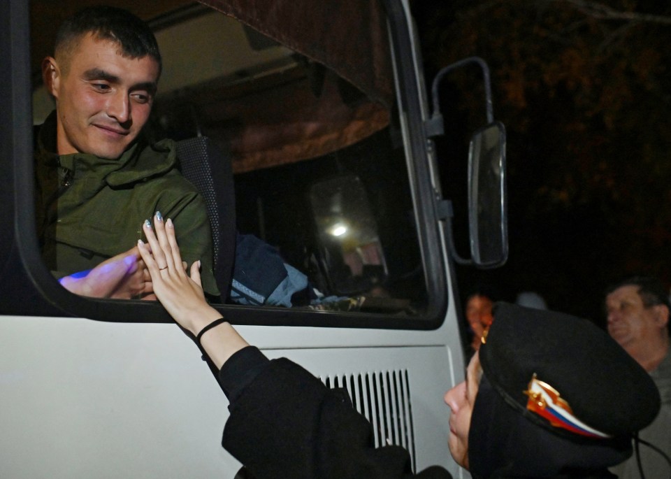 A woman says goodbye as Putin drafts more troops to the frontline in Ukraine