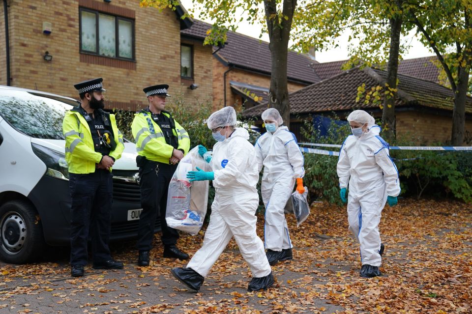 Police and forensic officers outside the house in Loxbeare Drive, Furzton, Milton Keynes