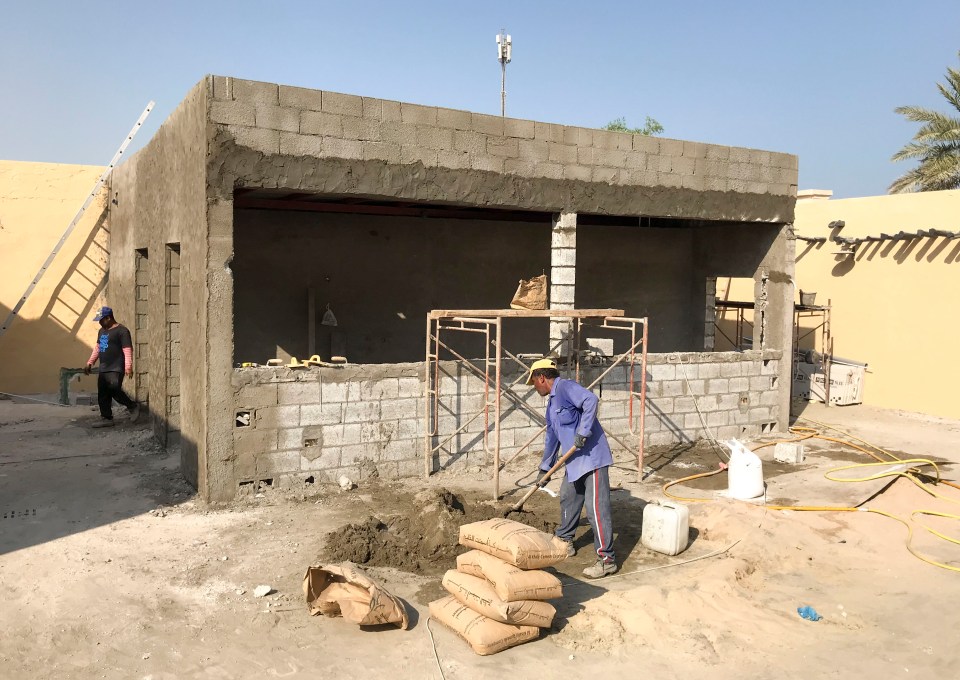 A pool bar and changing room were still being hewn from bare breeze blocks