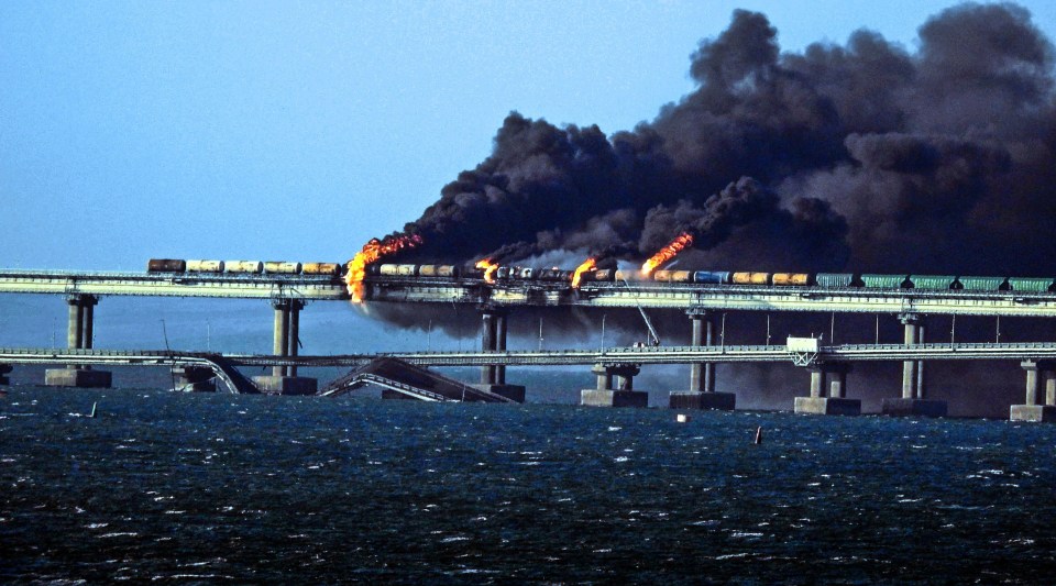 Black smoke billows from a fire on the Kerch bridge that links Crimea to Russia, after a truck exploded on Saturday