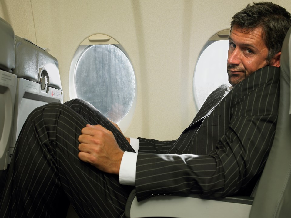 The man reclined his seat because he was tall and wanted to be comfortable during his flight (stock image)
