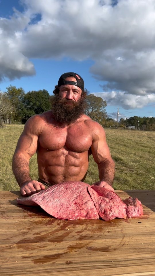 Liver King enjoys tucking into a cow's LUNG