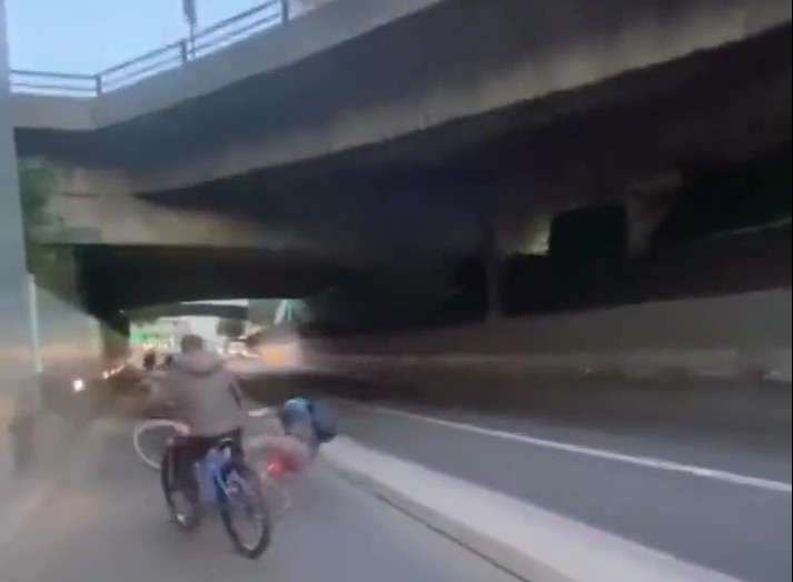 The man takes a tumble after trying to push the young man away