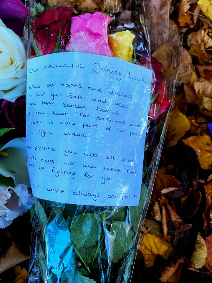 Floral tributes have been left outside the house in Milton Keynes