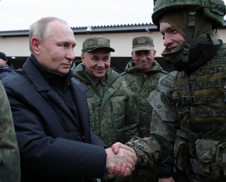 Vladimir Putin and defence boss Sergei Shoigu meet soldiers preparing to be sent to the frontline