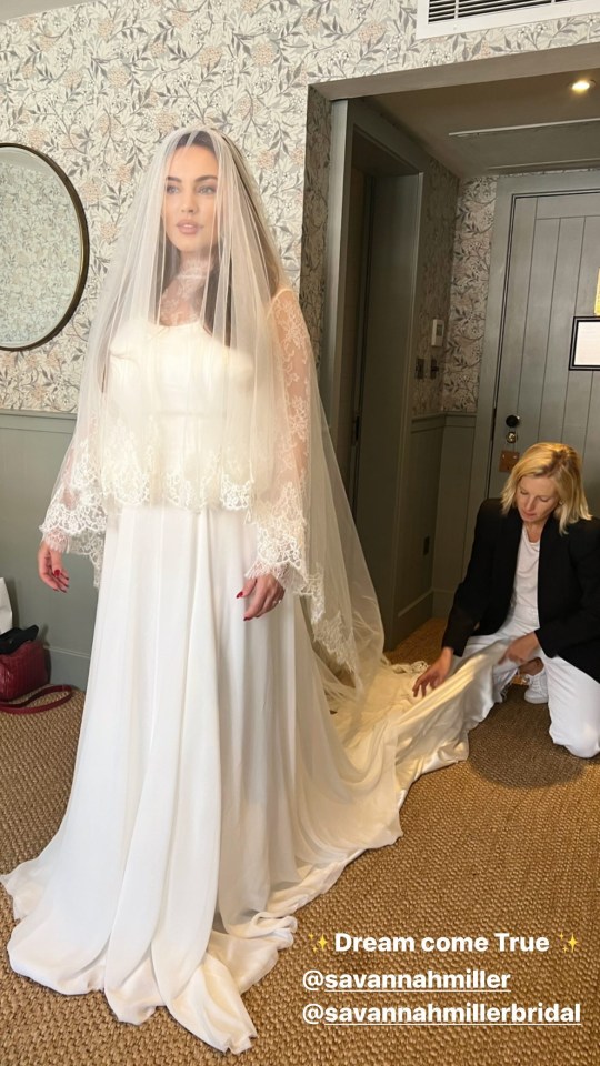 The blushing bride could be seen showing off her dress