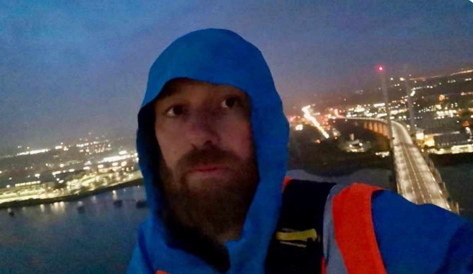 A bonkers selfie from one of the protesters, a teacher from London called 'Marcus', shows the pair high above the M25