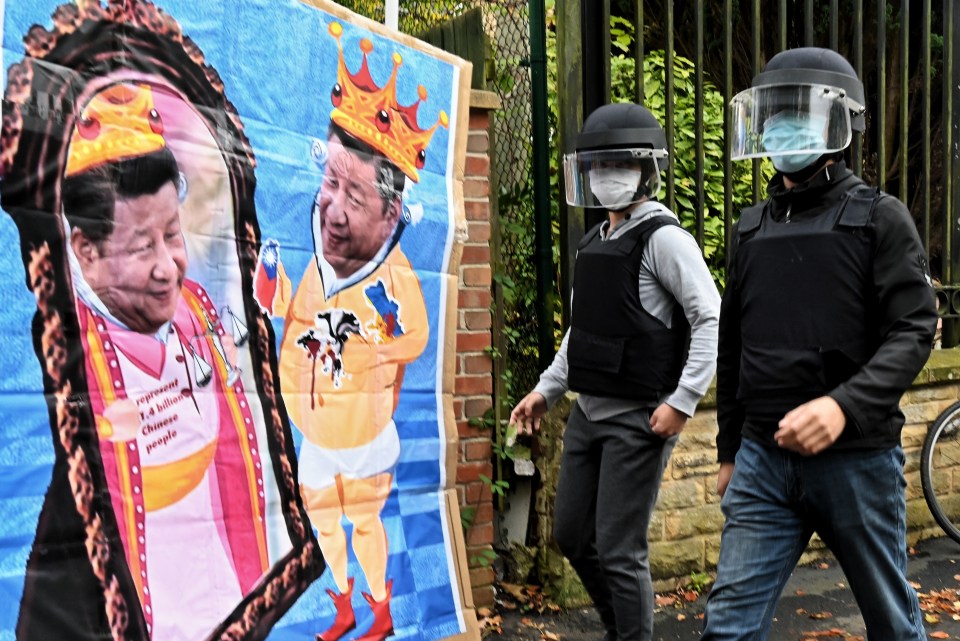 Protestors claim embassy staff vandalised signs and took away a satirical portrait