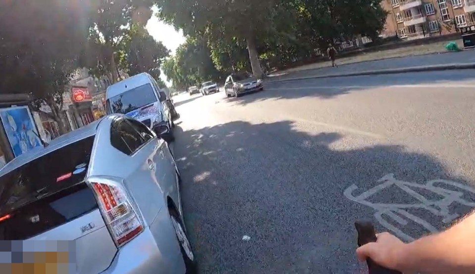 The footage appears to be filmed on the cyclist's helmet