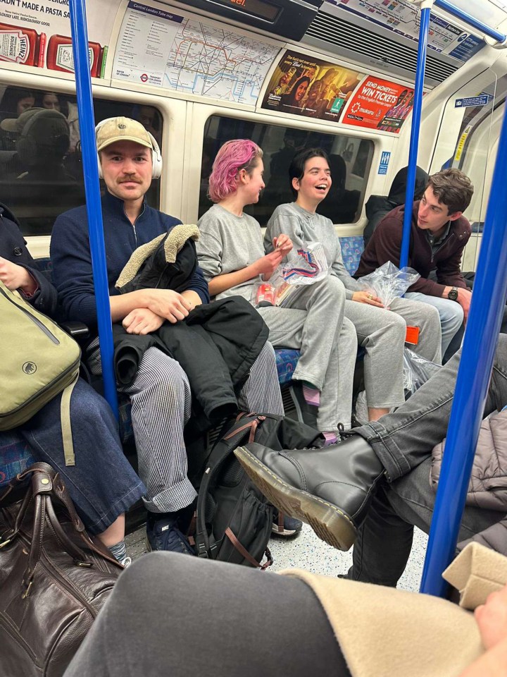 Two eco-protesters accused of throwing tomato soup over a Van Gogh painting have been seen laughing on London’s Tube after being released from police custody