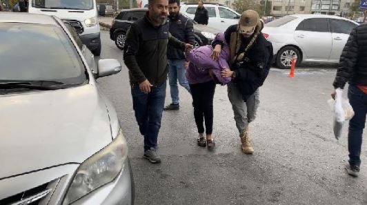 Albashir being dragged into custody after her arrest