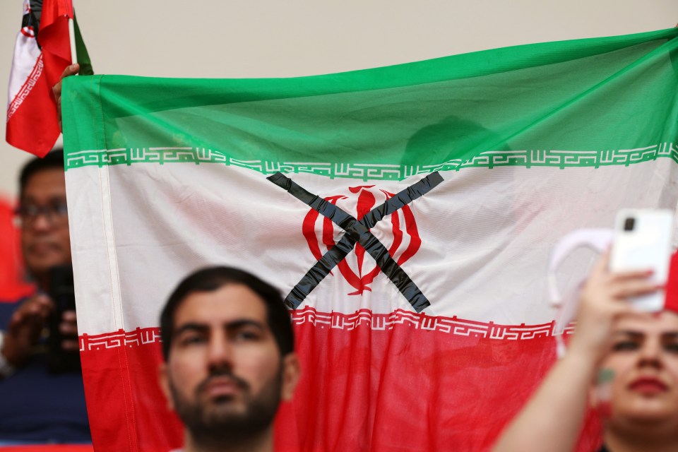 Black crosses were seen flying over the Iranian flag in the stadium