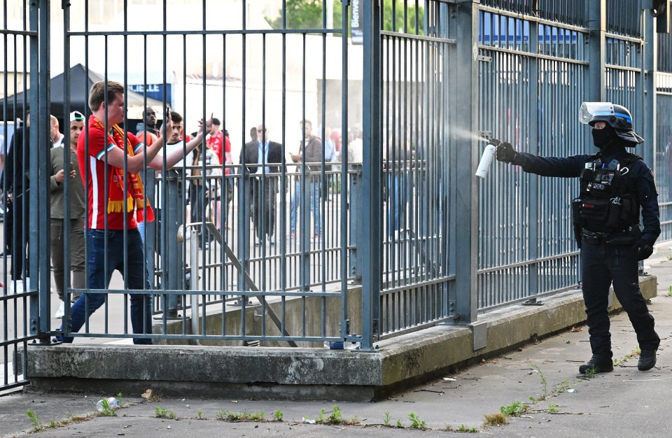 Police spray tear gas at Liverpool fans outside the Stade de France