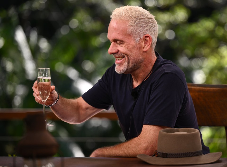 Chris glugged back a glass of champagne
