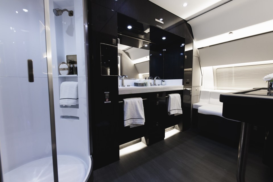 The en-suite bathroom has a walk-in rainfall shower and "his and hers" sinks