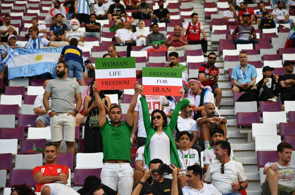 Iran supporters held protest signs with the rallying cries of 'Woman, Life, Freedom' and 'Freedom For Iran' at the Khalifa International Stadium in Doha yesterday