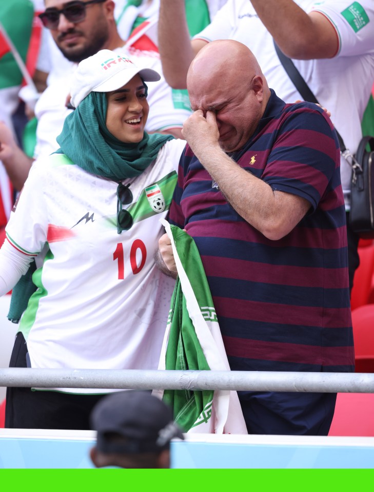 A fan breaks down in tears during the national anthem